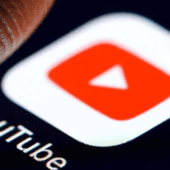 Youtube app with a finger about to press it